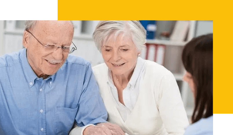 A man and woman looking at something on the screen.