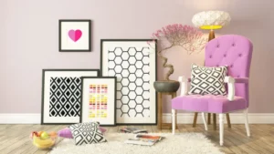 A room with many pictures and a pink chair