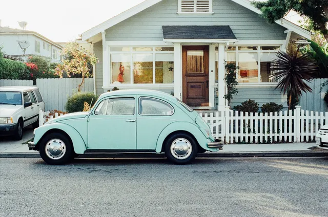 A car parked in front of a house.