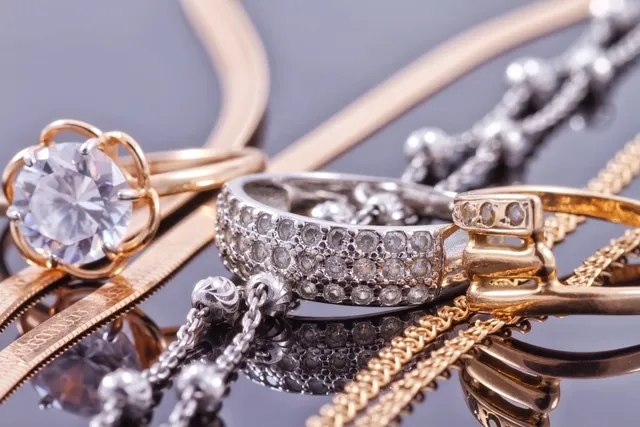 A close up of some gold and silver jewelry